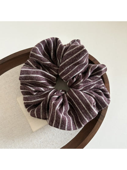 Gifty dark striped scrunchie displayed with matching accessories