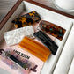 Beau curved bar hair clip held in hand displaying size and shape