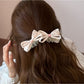 Close-up of Beau printed bow banana clip showing fabric texture and clasp