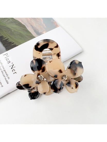 Top view of Beau vintage double flower hair claw clip displaying symmetrical flower shapes