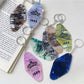Keychain attached to a set of keys highlighting the colorful diamond pendant
