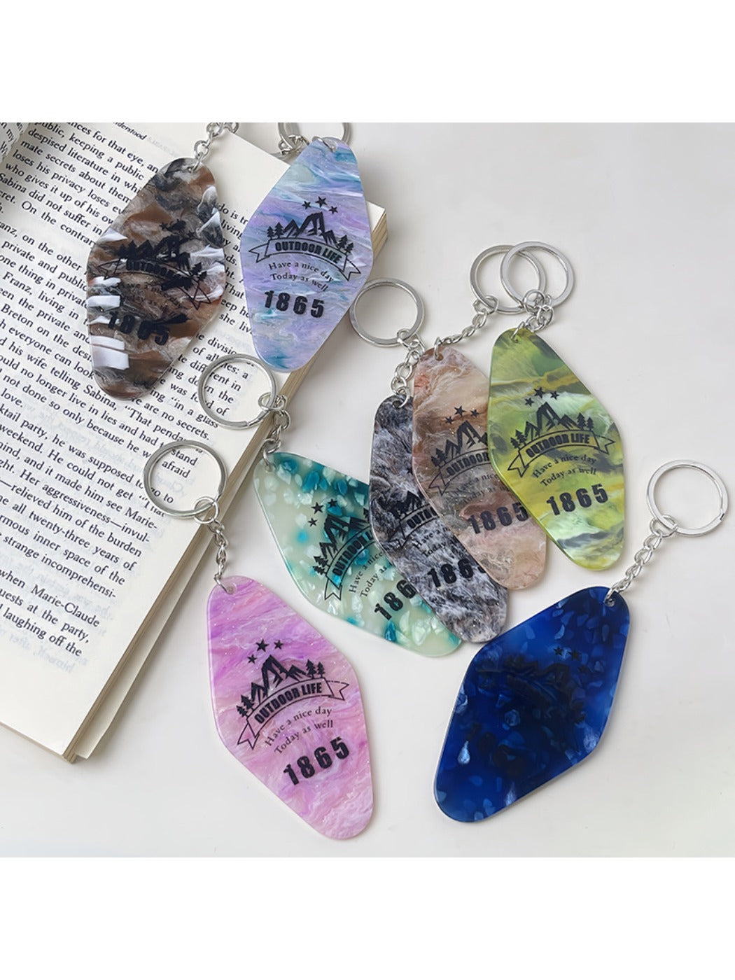 Keychain attached to a set of keys highlighting the colorful diamond pendant