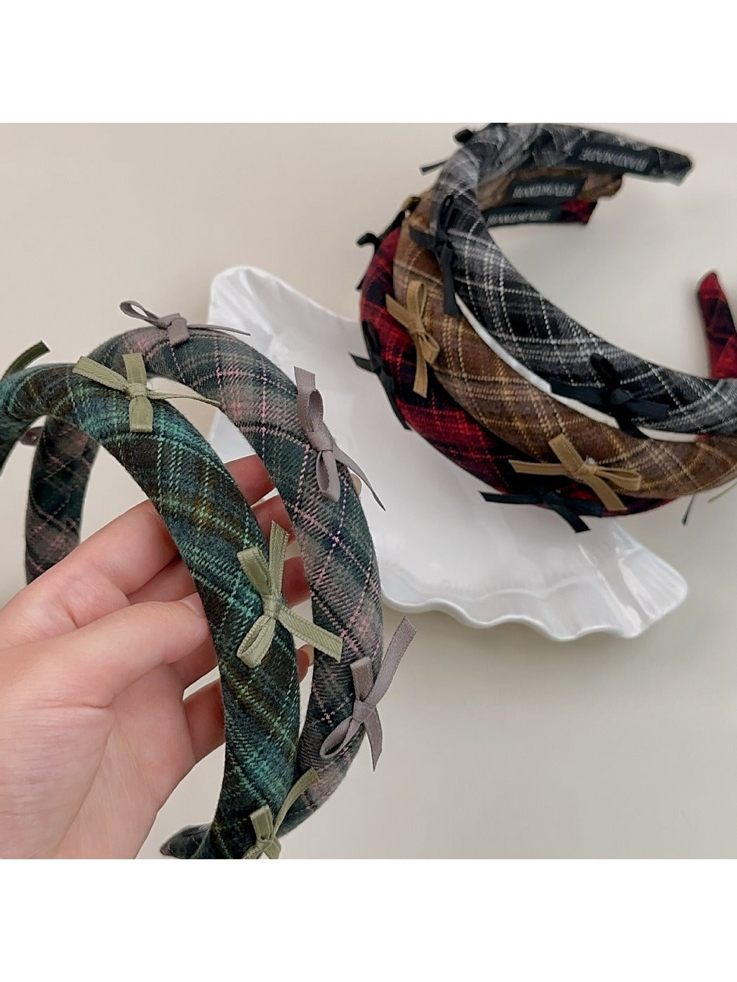 Gifty plaid bow headband on white background showing front view