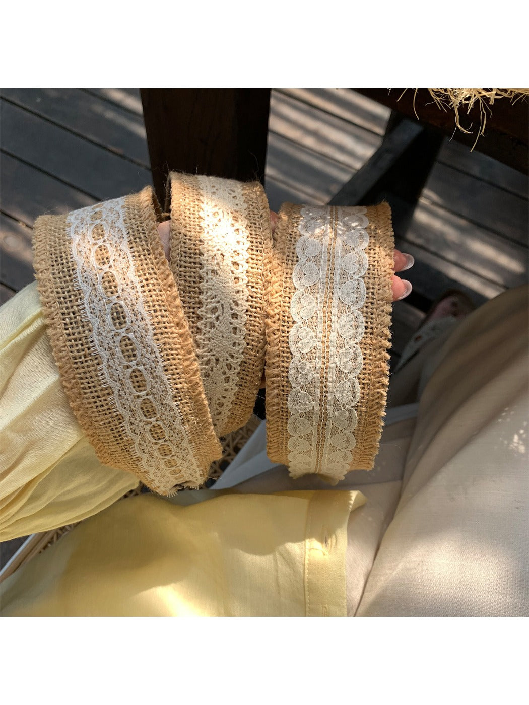 Soft straw woven lace headband in natural beige color displayed on white background