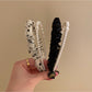 Close-up of delicate tulle bow detail on vintage-inspired headband