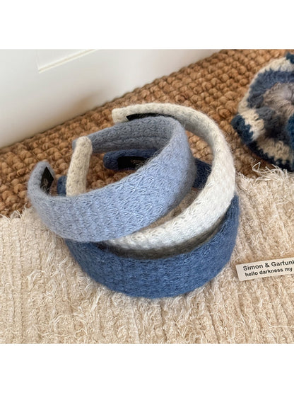 Gifty headband displayed flat highlighting diamond pattern and fabric detail