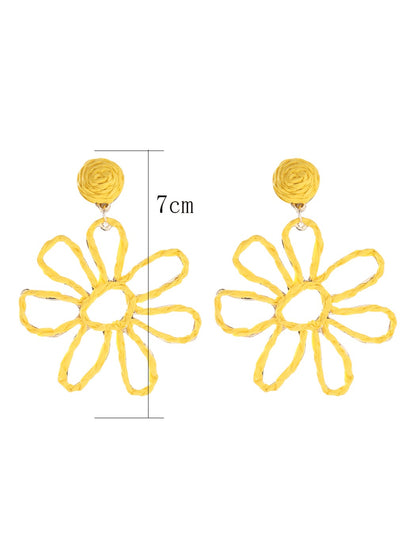 Side view of Earedge flower shaped openwork drop earring showing delicate drop detail