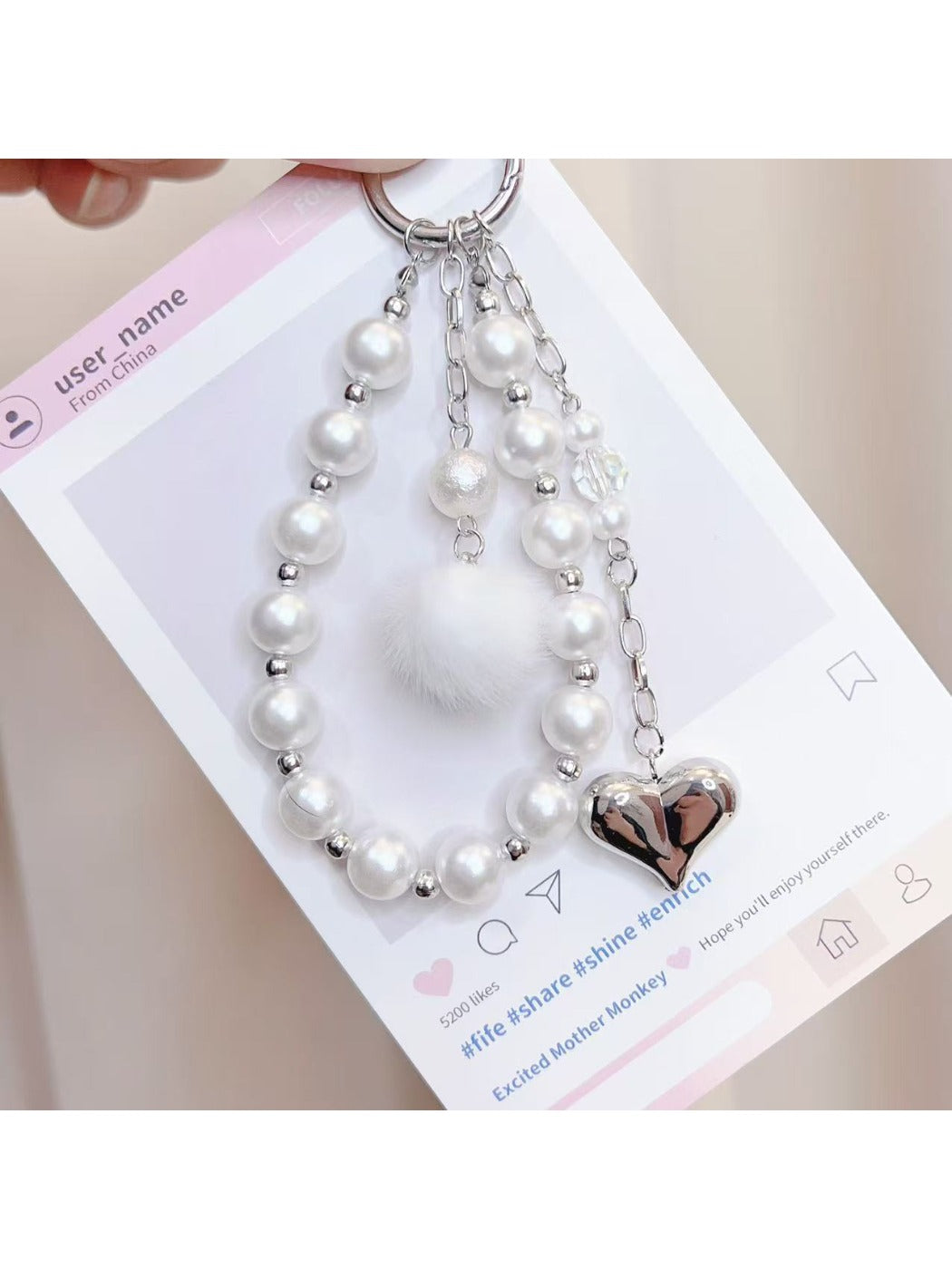 Keypus heart-shaped beaded pendant keychain displayed hanging from a keyring