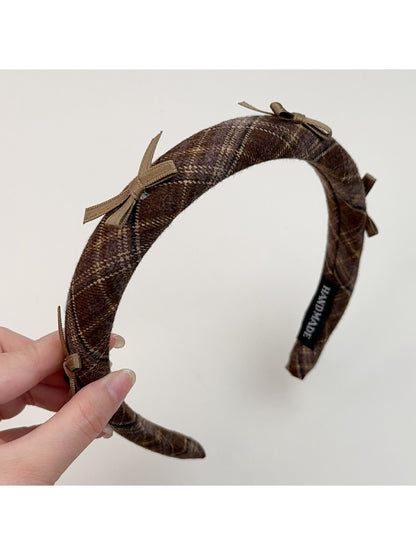 Top view of Gifty plaid bow headband displaying bow and band