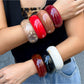 Lovra round bangle bracelet worn on wrist with casual outfit