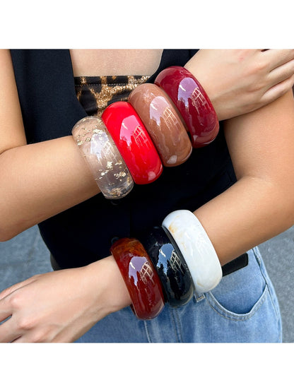 Lovra round bangle bracelet worn on wrist with casual outfit