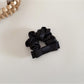Close-up of the satin bow scrunchie fabric texture and stitching details