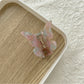 Top view of Beau butterfly claw clip displaying symmetrical wing design
