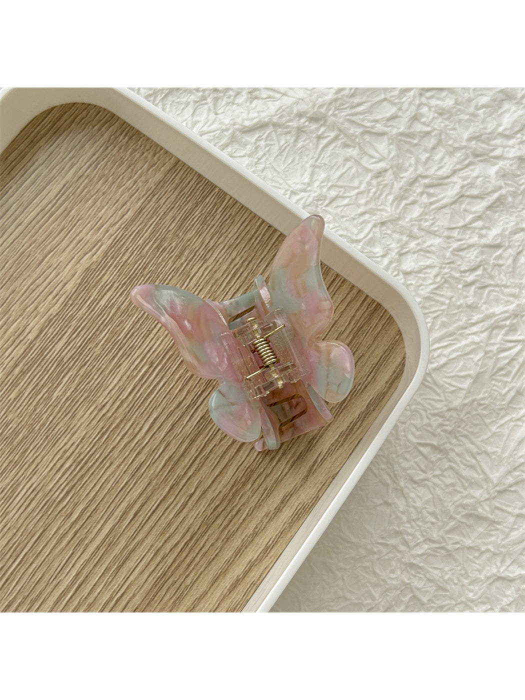 Top view of Beau butterfly claw clip displaying symmetrical wing design