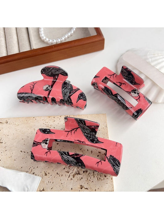 Beau hair claw clip with black crow pattern on translucent material