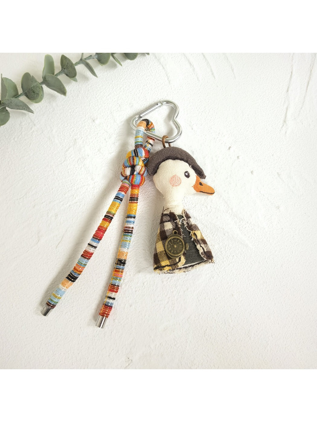 Duck charm keychain displayed on a white background with soft shadows