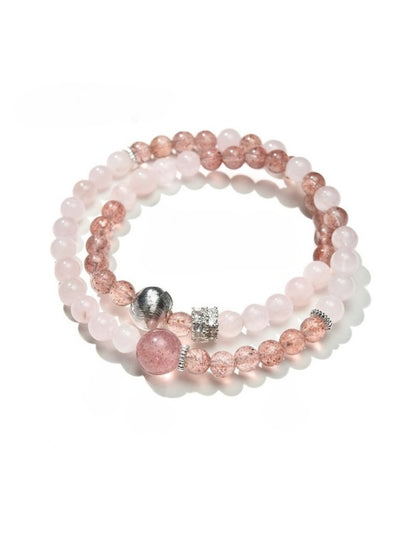 Lovra elegant bracelet with pink and neutral colorblock beads laid flat on a surface