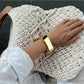Artistic angle of Lovra Chic Irregular Bangle Bracelet emphasizing irregular design