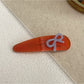 Beau - Bow Embellished Oval Hair Clip