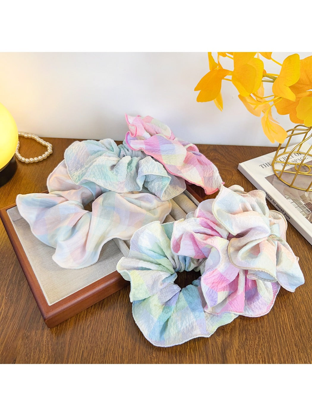 Gifty ruffled scrunchie displayed on a white background showing its texture and colors