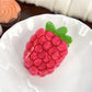 Set of colorful fruit shaped hair claw clips displayed on a flat surface