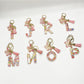 Butterfly and letter pendant keychain displayed on a wooden surface