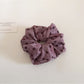 Gifty scrunchie styled in hair with visible floral and polka dot print