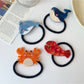 Close-up of Gifty hair tie showing detailed ocean animal illustrations on fabric