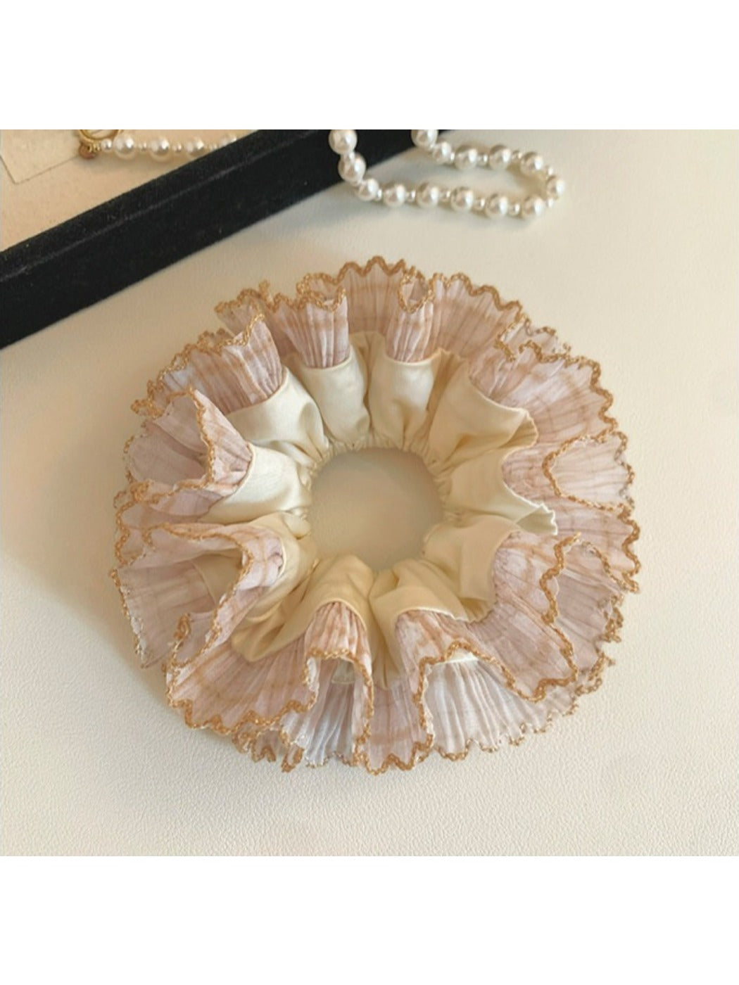 Side view of Gifty satin hair scrunchie showing gathered fabric and lace detail