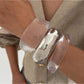 Lovra wide band bangle bracelet worn on wrist with casual outfit