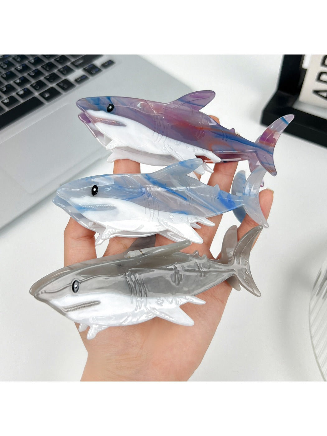 Close-up of Beau shark shaped hair claw clip showing smooth matte finish