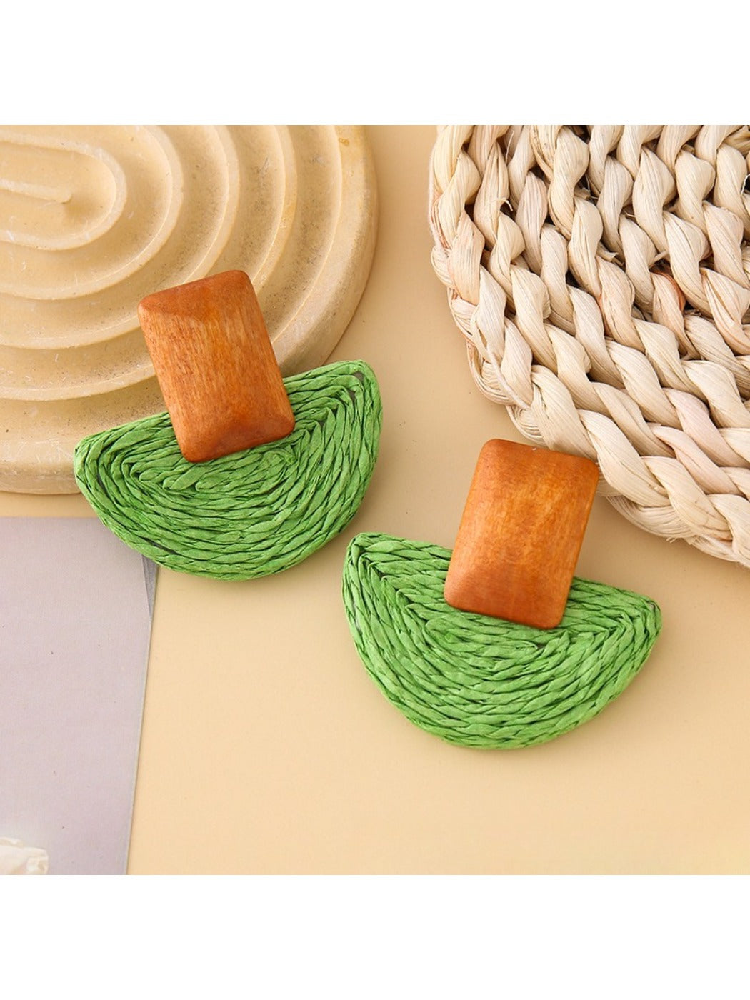 Earedge raffia mushroom shaped stud earrings in natural light with shadows