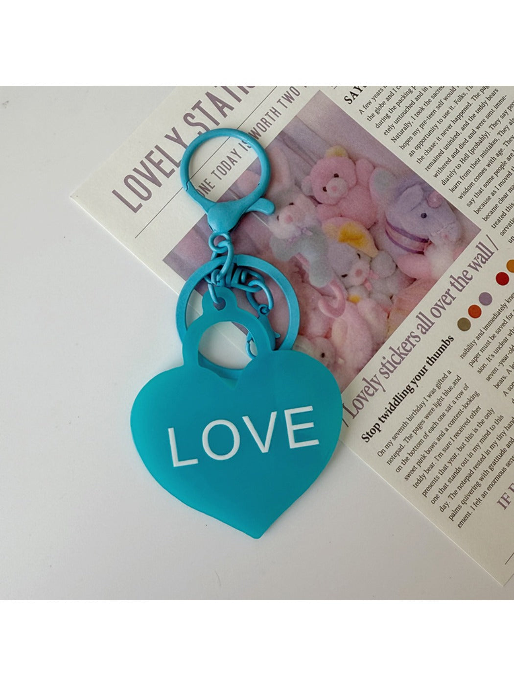 Pink heart-shaped pendant keychain displayed on a white surface