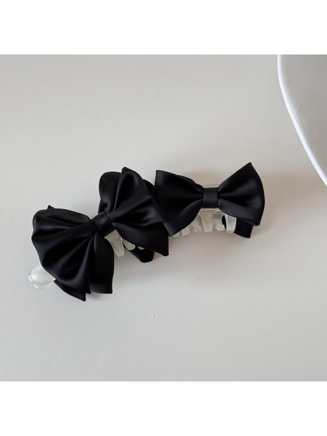 Beau satin bow banana clip displayed open showing clip mechanism