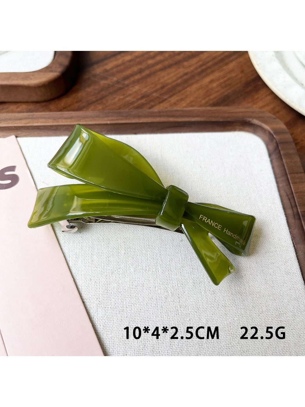 Beau acetate hair clip displayed with other hair accessories on table