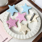 Beau star hair clip clipped into brown hair