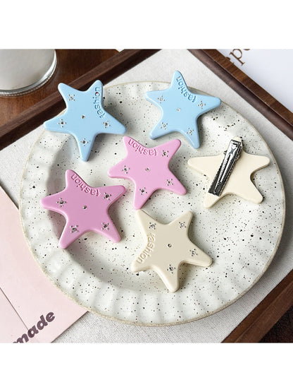 Beau star hair clip clipped into brown hair