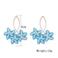 Side view of Earedge Sweet Flower Shaped Drop Earrings highlighting the drop design