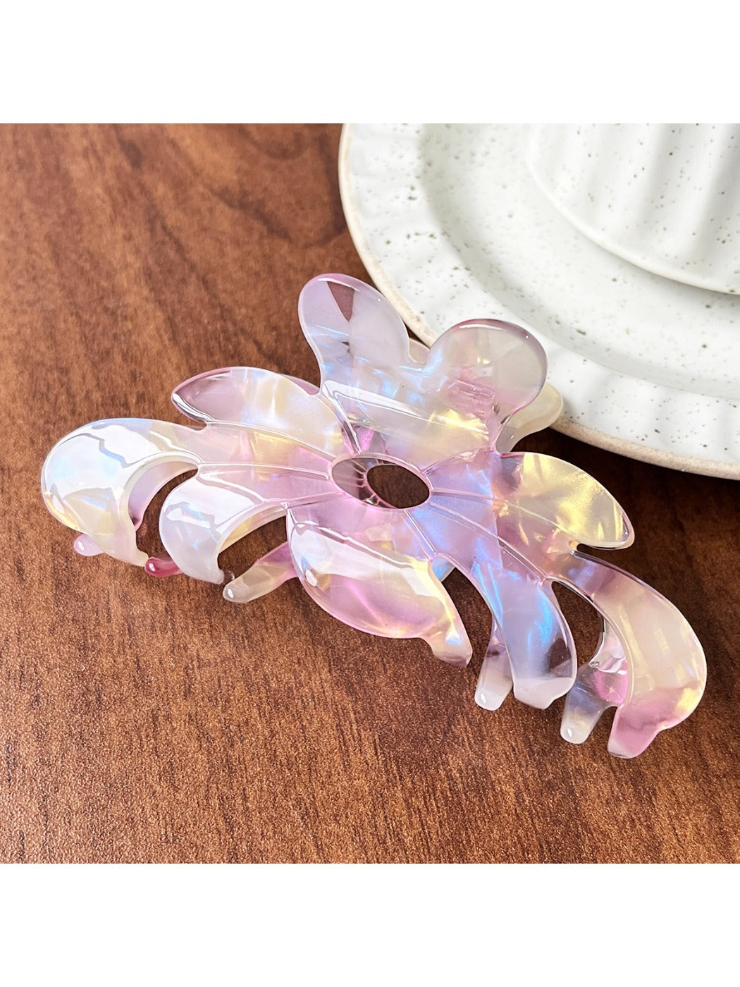 Beau flower shaped claw clip photographed with natural lighting on white