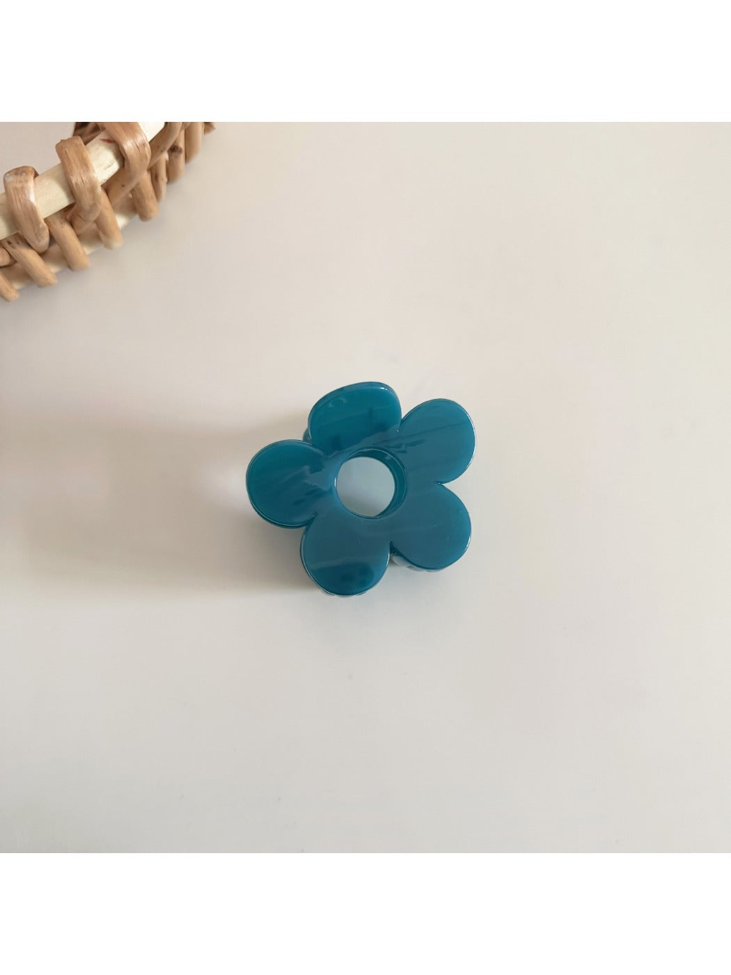 Side view of Beau flower hair clip highlighting clip mechanism and petal layers