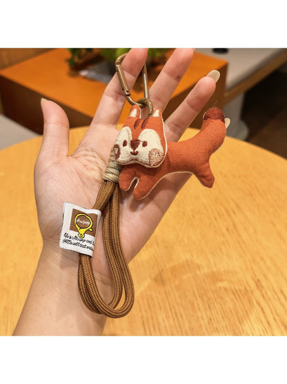 Side view of Keypus squirrel charm keychain showing its bushy tail design
