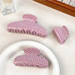 Beau pink polka dot hair claw clip open to show spring mechanism