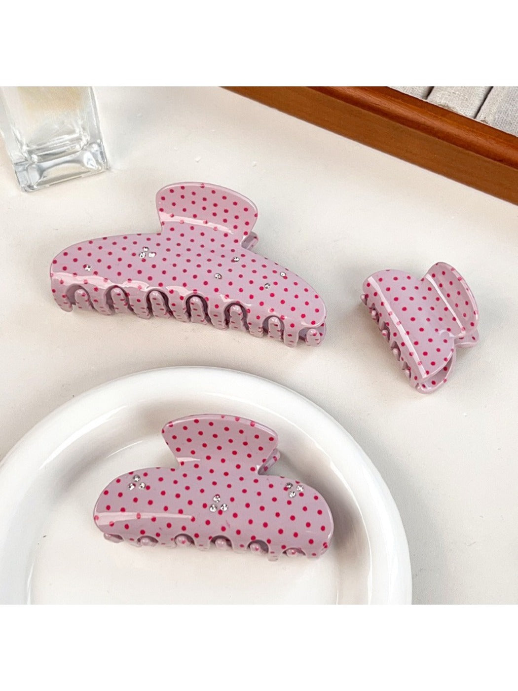 Beau pink polka dot hair claw clip open to show spring mechanism
