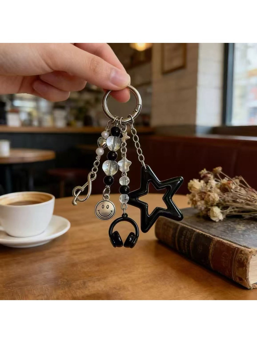 Keychain attached to a set of keys on a wooden surface