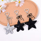Star shaped bag charm keychain in metallic gold with a small ring attachment