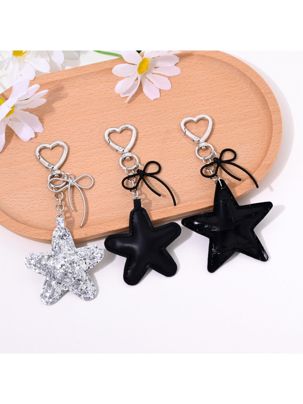 Star shaped bag charm keychain in metallic gold with a small ring attachment