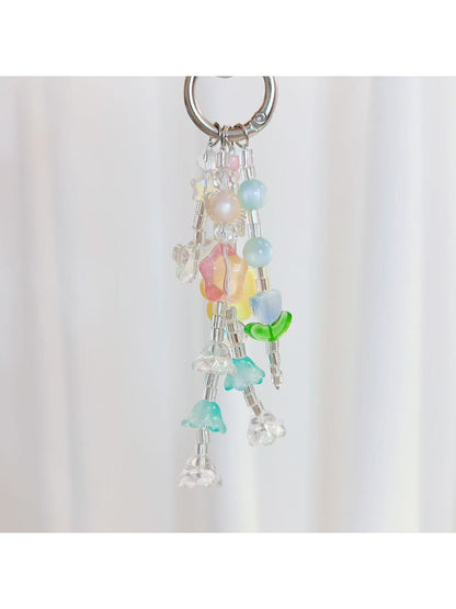 Keypus keychain showing star and flower charms hanging from gold keyring