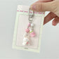 Pink bunny keychain displayed on a white background showing its full shape