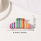 Beau colorful striped half moon claw clip displayed with matching accessories