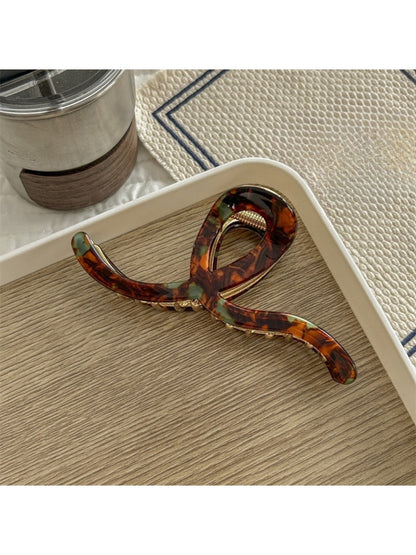 Beau Artistic Bright Hair Clip displayed on white surface with natural lighting emphasizing bright hues